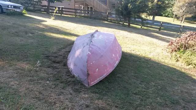 boat upside down on lawn